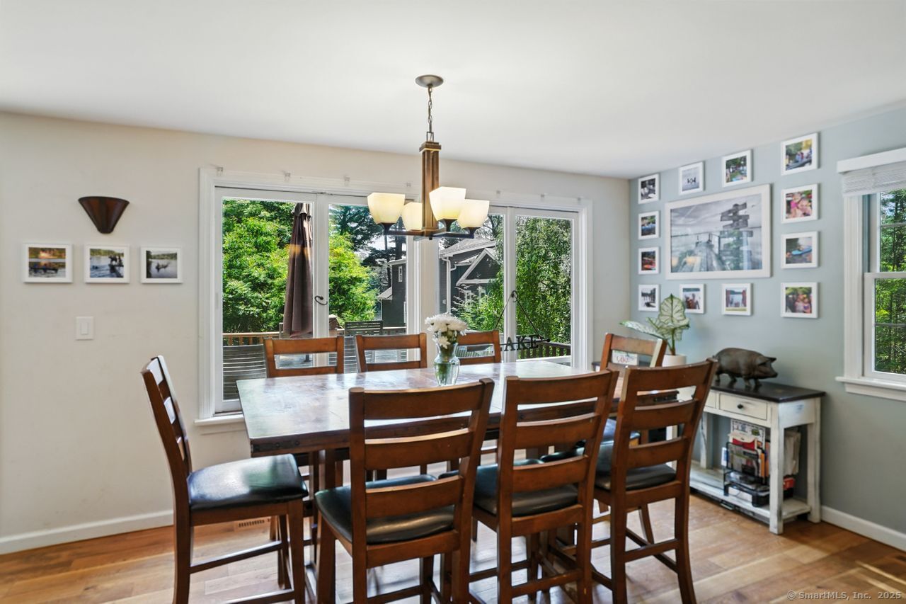 68 Old Dike Road Trumbull, CT 06611 - Photo 9 of 40 a dining room with furniture a chandelier and wooden floor
