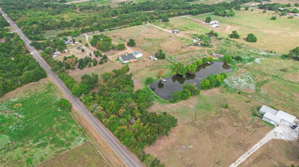 7944 County Road 669 Blue Ridge, TX 75424 - Photo 34 of 37 an aerial view of residential houses with outdoor space