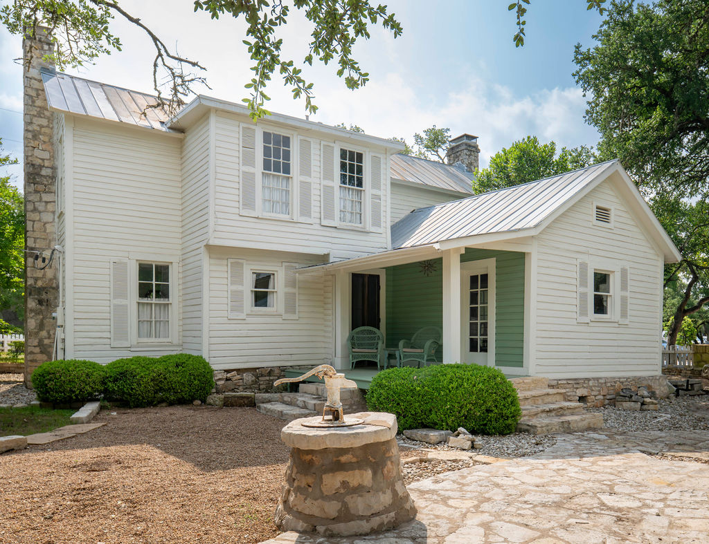 200 Bluff Street Dripping Springs, TX 78620 - Photo 14 of 16 a view of a house with a yard