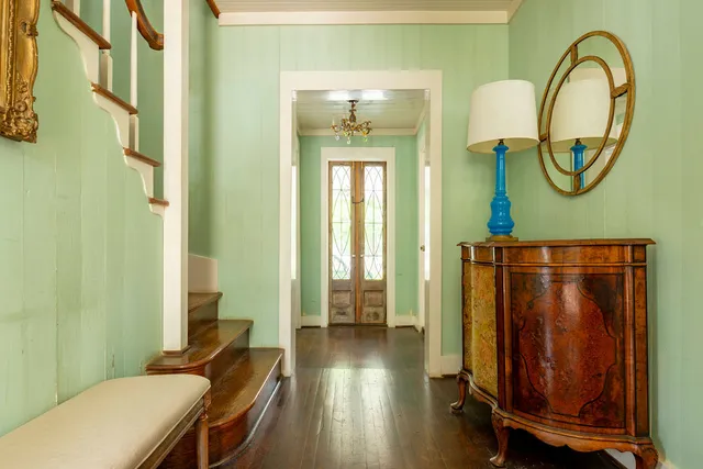 a view of a livingroom with furniture and hardwood floor