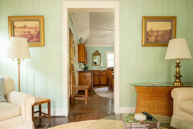 a living room with furniture and a table