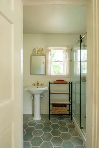 a bathroom with a sink and a mirror