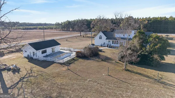 a kitchen with stainless steel appliances granite countertop a refrigerator and a stove