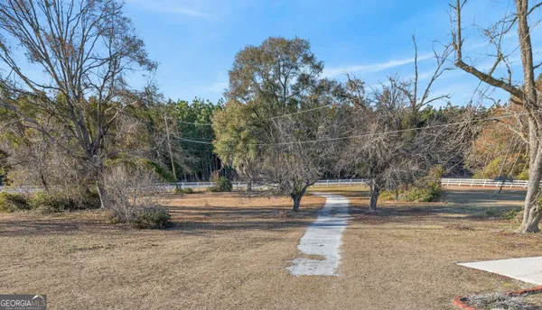 a view of a hallway with a chandelier