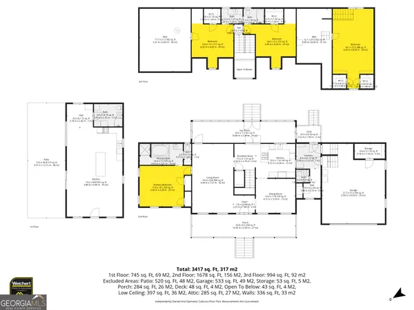 a front view of house with yard and trees around