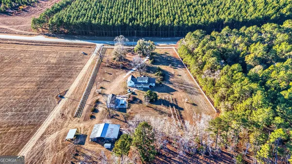 a kitchen with stainless steel appliances granite countertop a refrigerator a stove and a sink