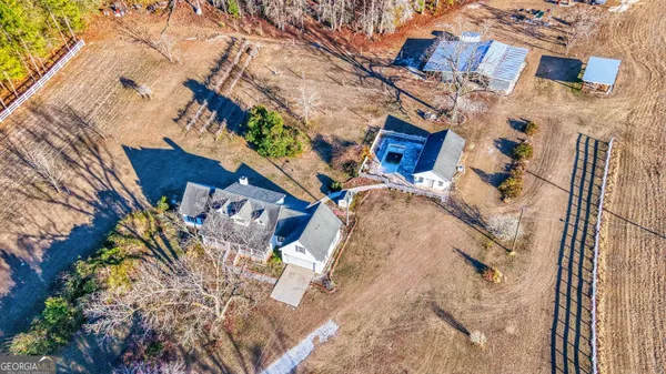 a house that has a tree in front of it