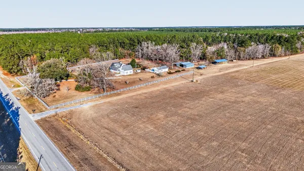 a aerial view of a house with a yard