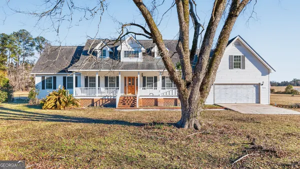 a aerial view of a house with a yard