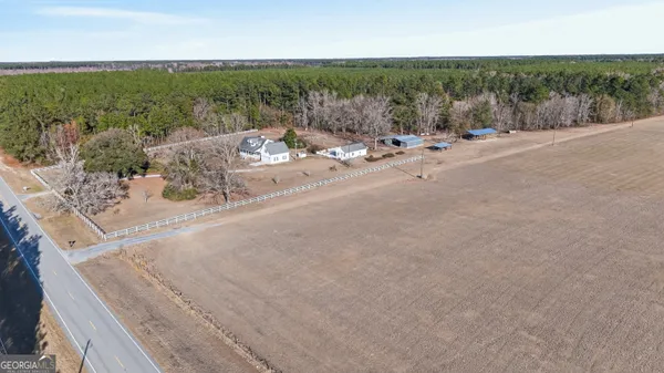 a view of a house with outdoor space and sitting area