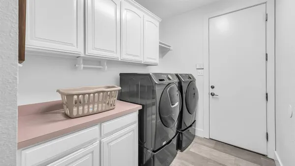 a kitchen with appliances cabinets and a counter top space
