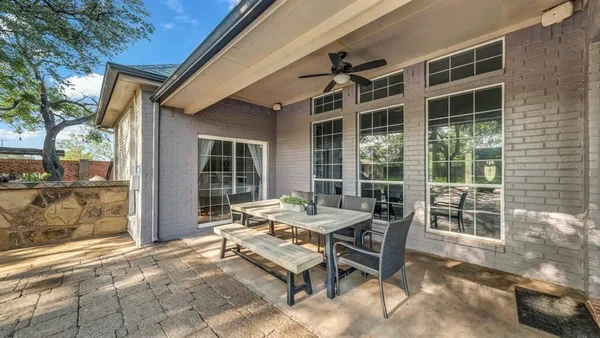 a table and chairs in front of a building