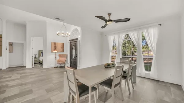 a view of a dining room with furniture and a table