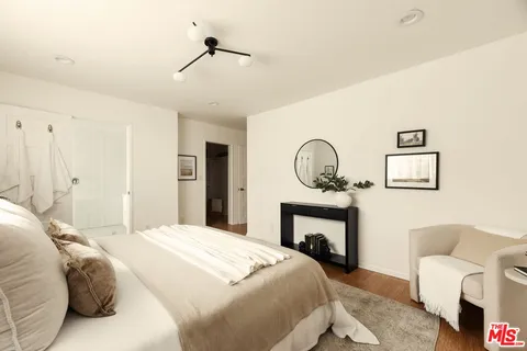 a bedroom with a bed and a fireplace