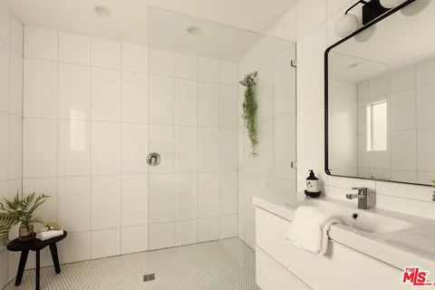 a bathroom with a bathtub and a sink