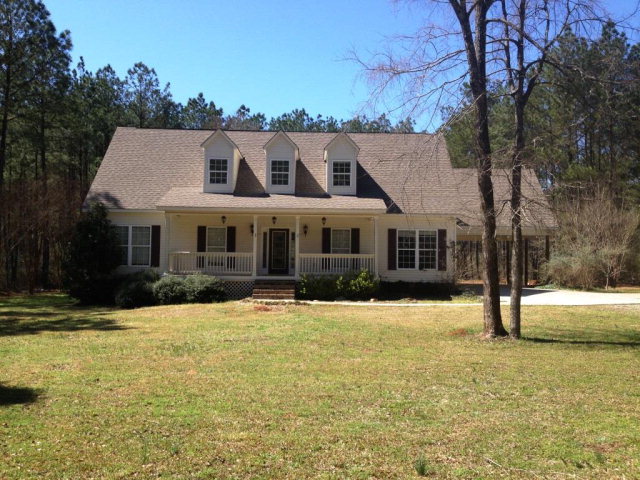 346 Dye Road Gray, GA 31032 - Photo 1 of 1 a front view of house with yard and trees in the background