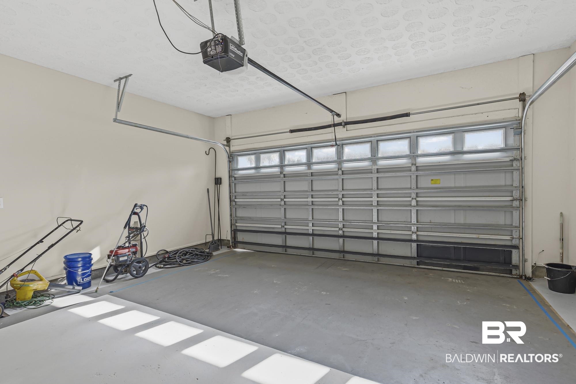 1153 Sloane Cove Foley, AL 36535 - Photo 22 of 25 Garage featuring a garage door opener