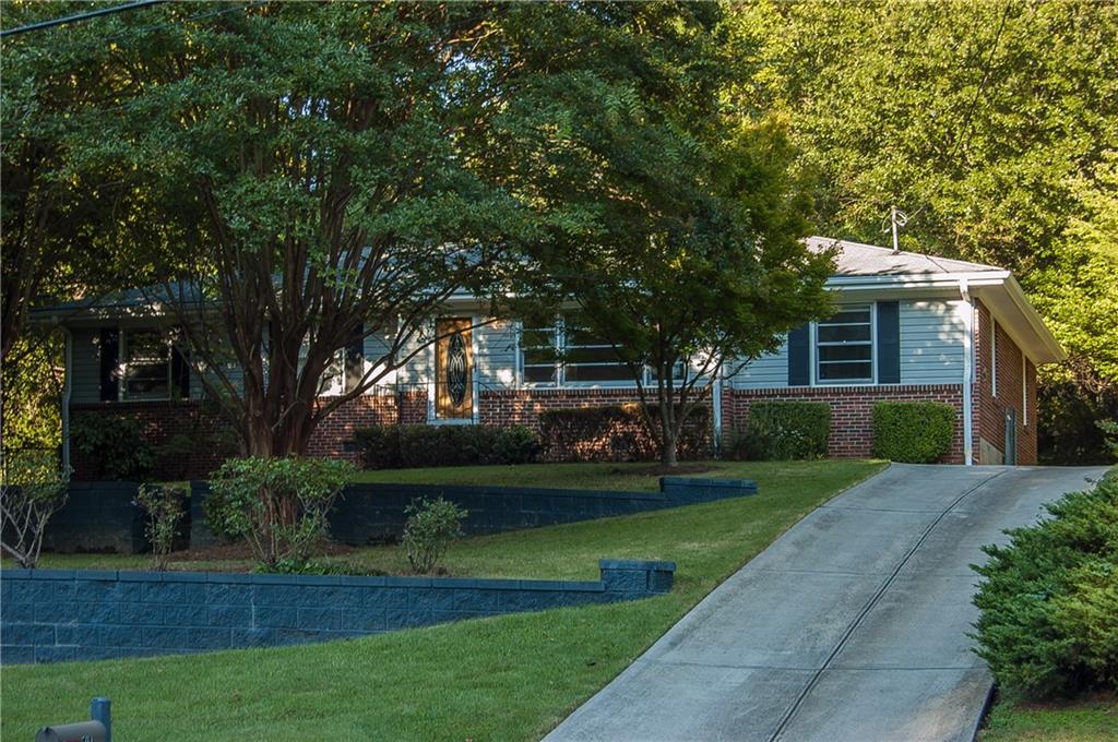 594 Densley Drive Decatur, GA 30033 - Photo 1 of 1 a front view of a house with a garden