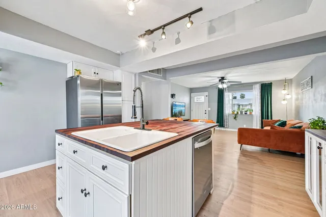 a bedroom with furniture and wooden floor