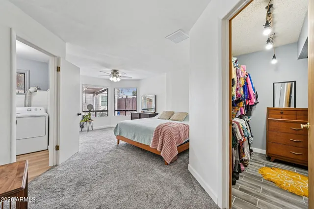 a bedroom with a bed dresser and a window