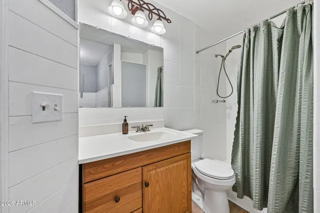 a view of a house with swimming pool and sitting area