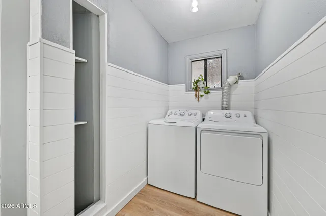 a view of a house with backyard sitting area and garden