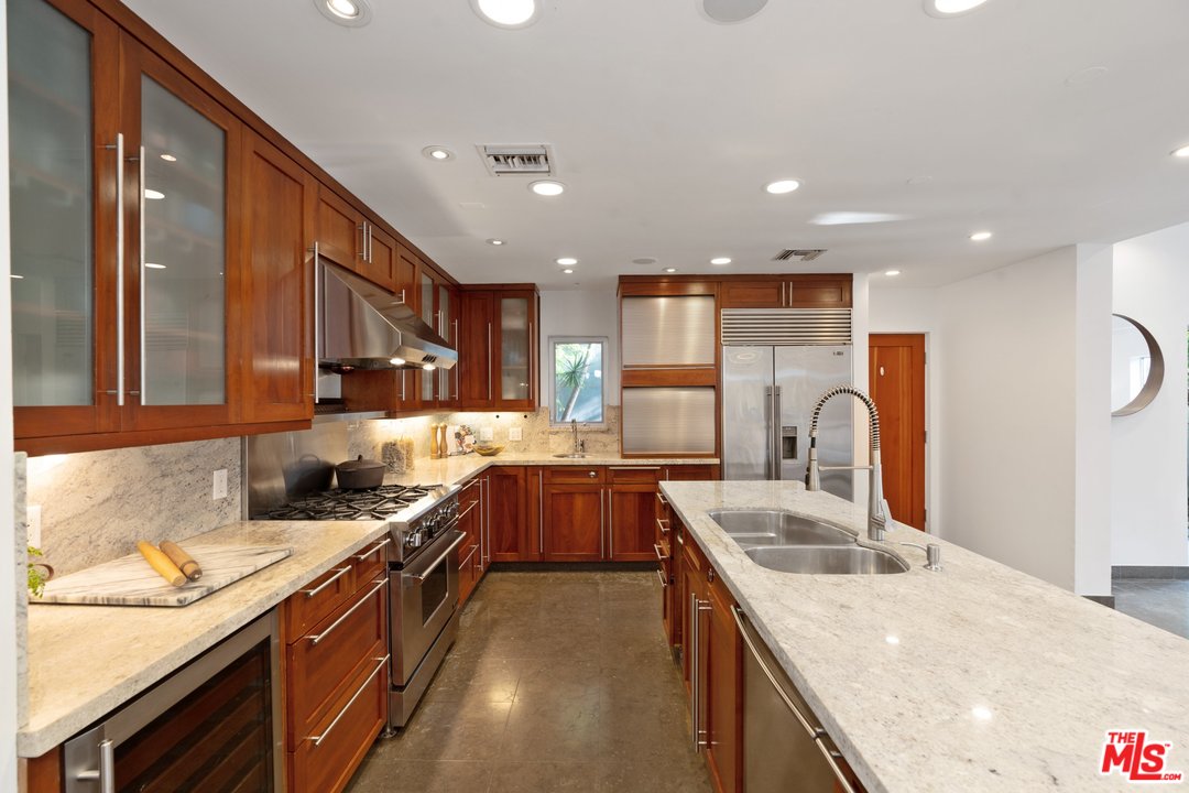 918 Howard Street Marina del Rey, CA 90292 - Photo 14 of 38 a kitchen with stainless steel appliances granite countertop a sink stove and refrigerator