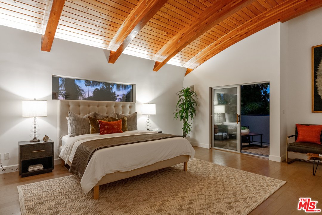 918 Howard Street Marina del Rey, CA 90292 - Photo 19 of 38 a bedroom with a bed a couch and potted plant with view of living room