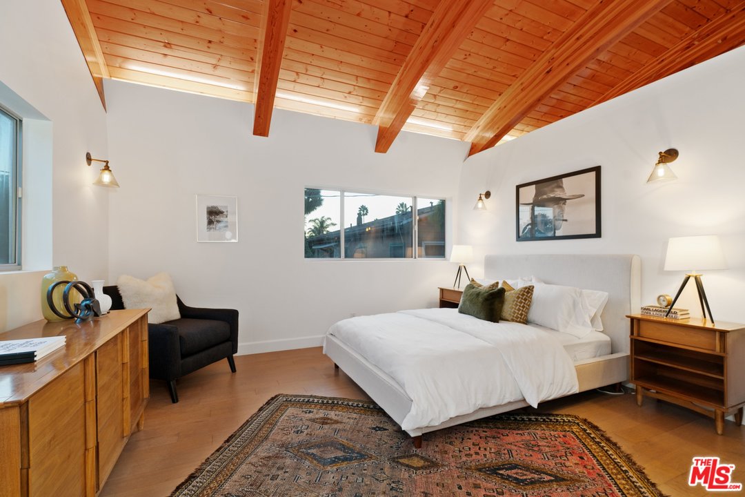 918 Howard Street Marina del Rey, CA 90292 - Photo 23 of 38 a bedroom with a bed and wooden floor