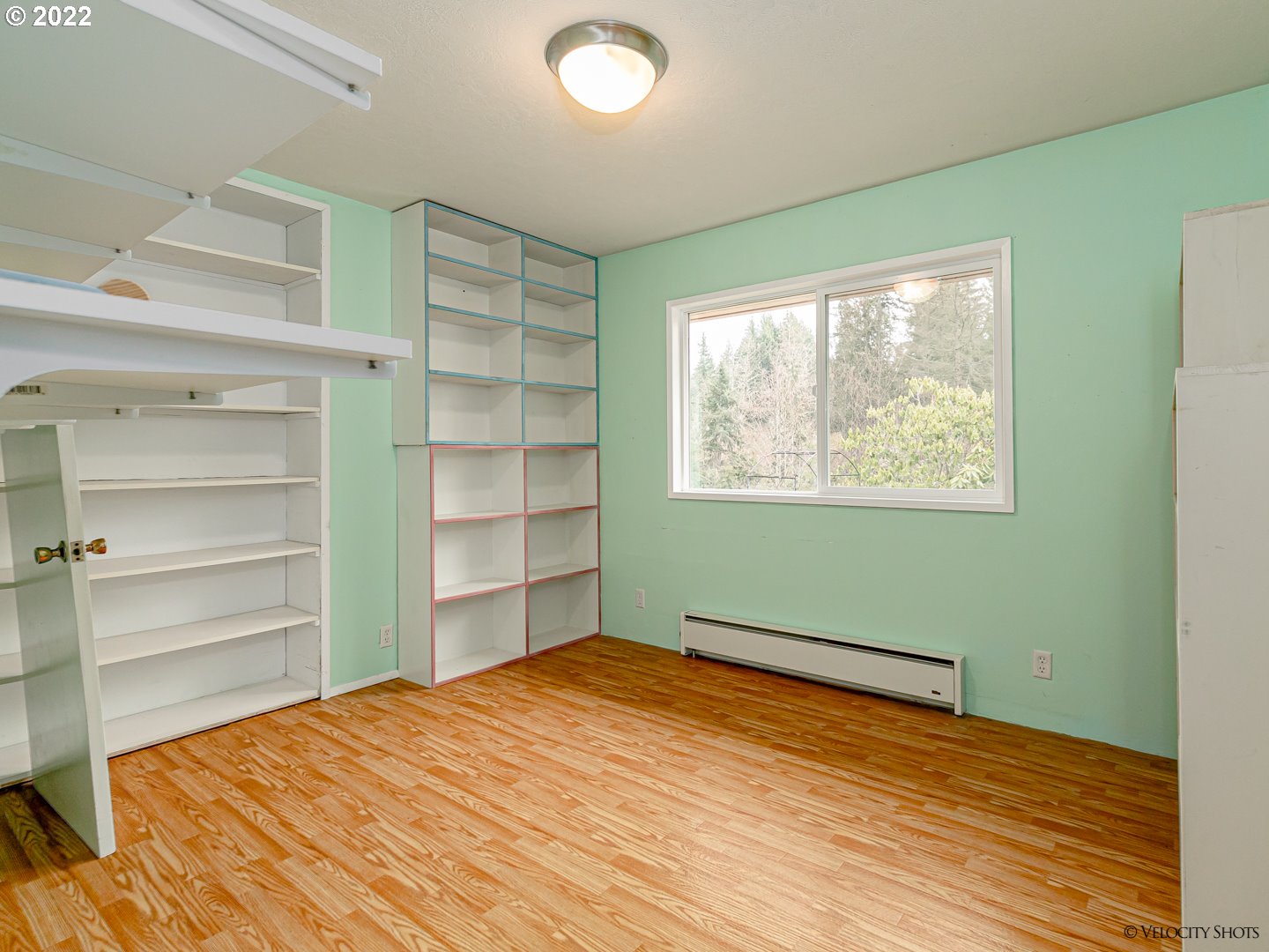 40050 Southeast Paul Moore Road Sandy, OR 97055 - Photo 11 of 32 a bedroom with a bed and a window
