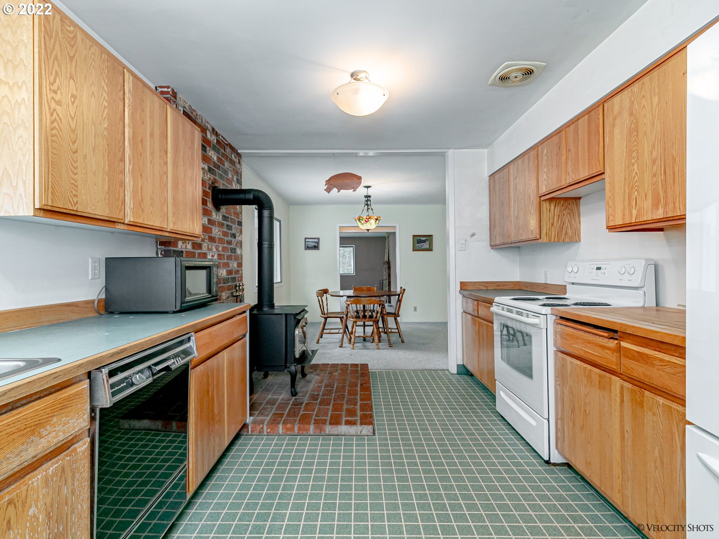 40050 Southeast Paul Moore Road Sandy, OR 97055 - Photo 6 of 32 a kitchen with stainless steel appliances granite countertop a stove a sink and a microwave