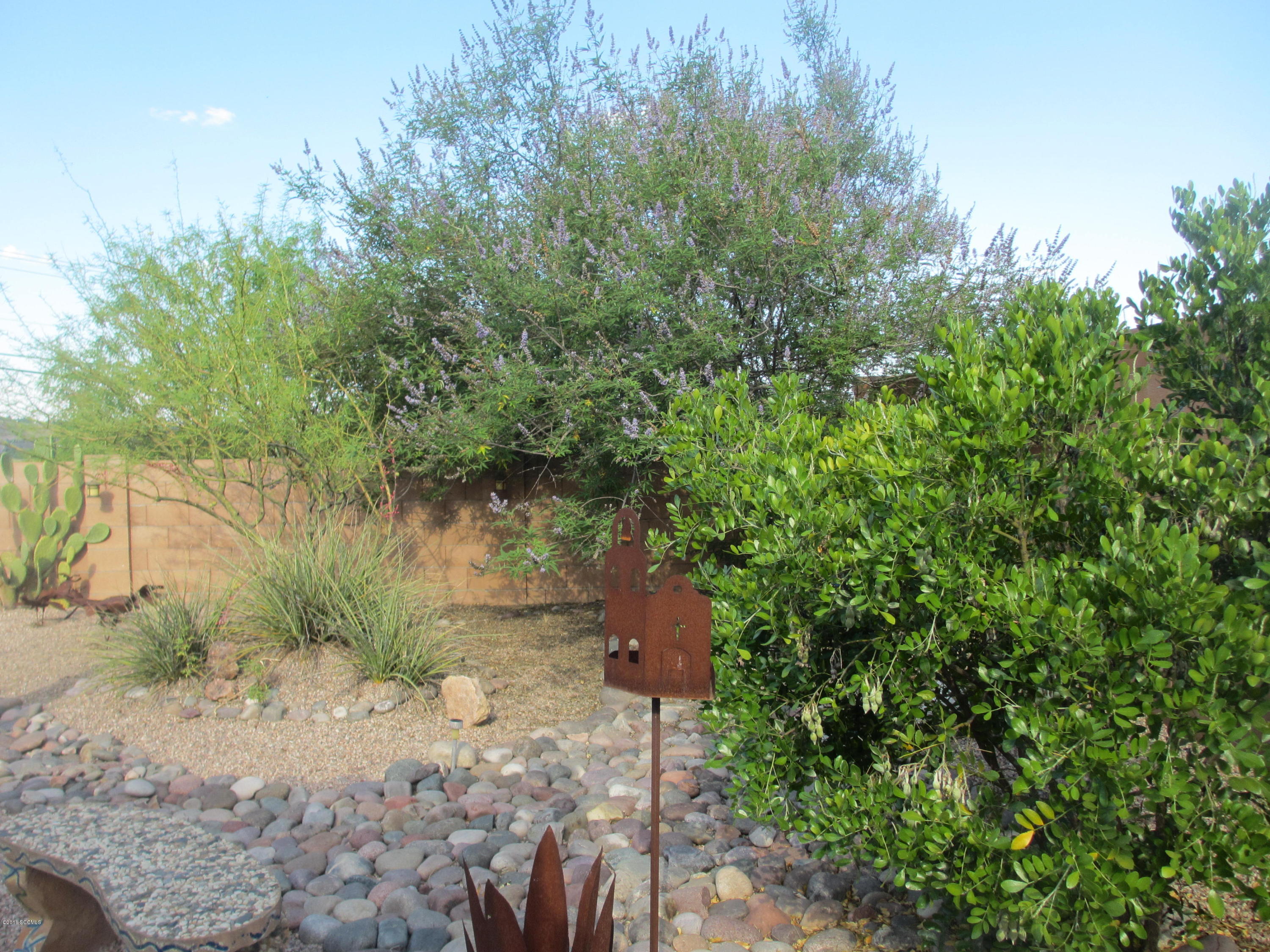 353 Via Bella Donna Rio Rico, AZ 85648 - Photo 31 of 44 a backyard of a house with a yard and outdoor seating