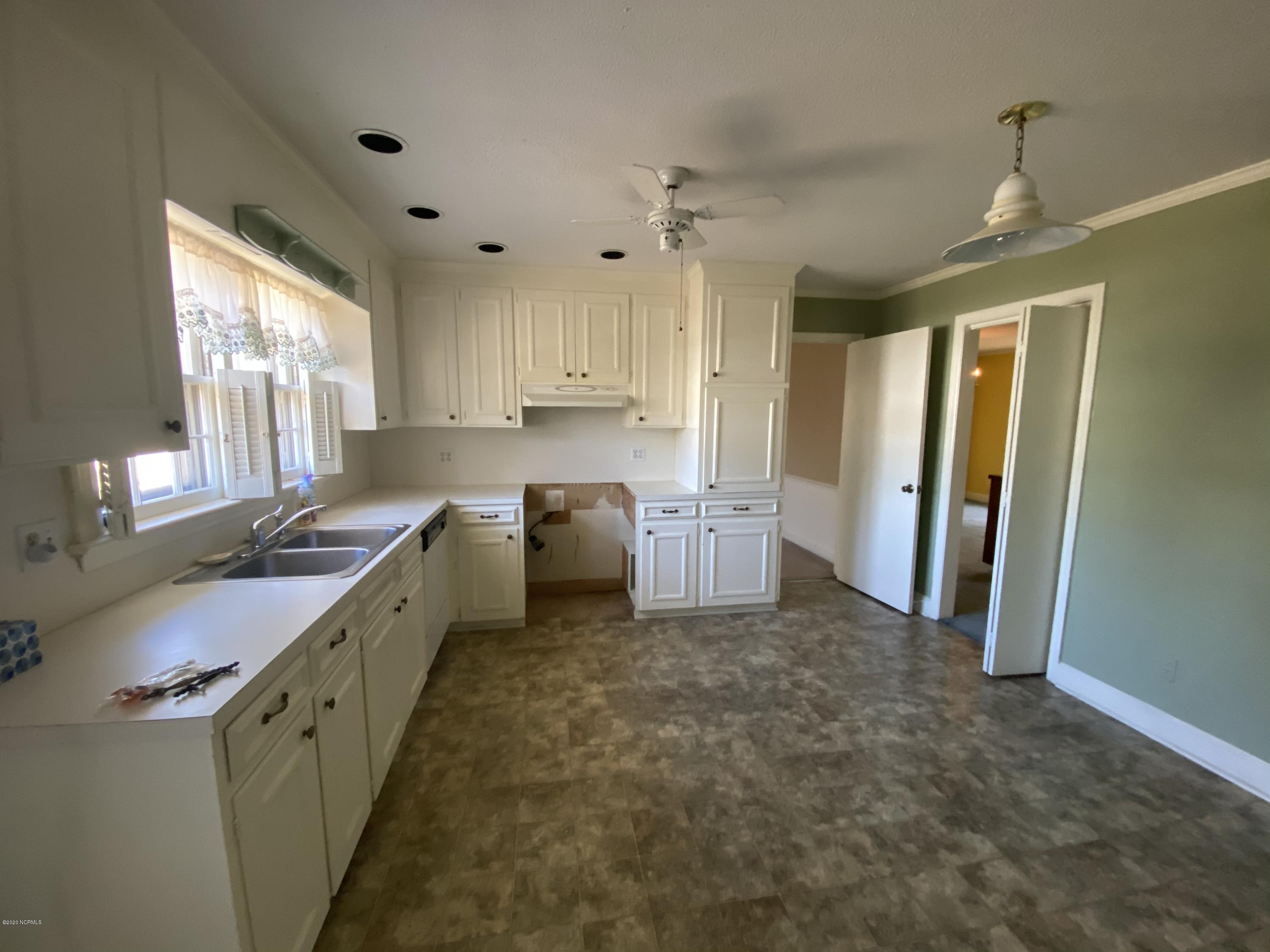 2308 Hardee Road Kinston, NC 28504 - Photo 4 of 23 Kitchen view from the carport entrance. Dining room is to the far right.