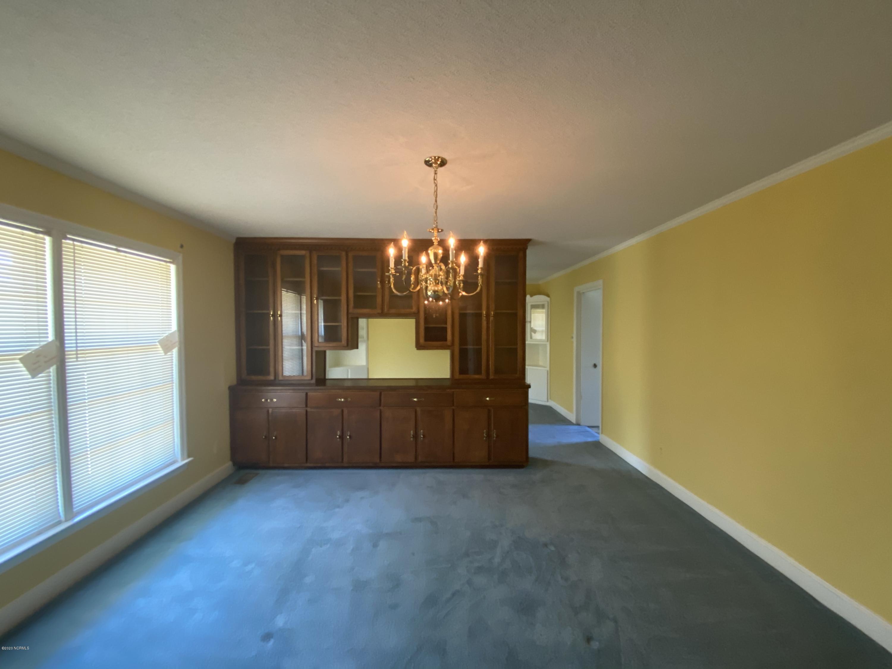 2308 Hardee Road Kinston, NC 28504 - Photo 6 of 23 Cabinet wall was built in to divide the formal dining area into two separate dining areas.