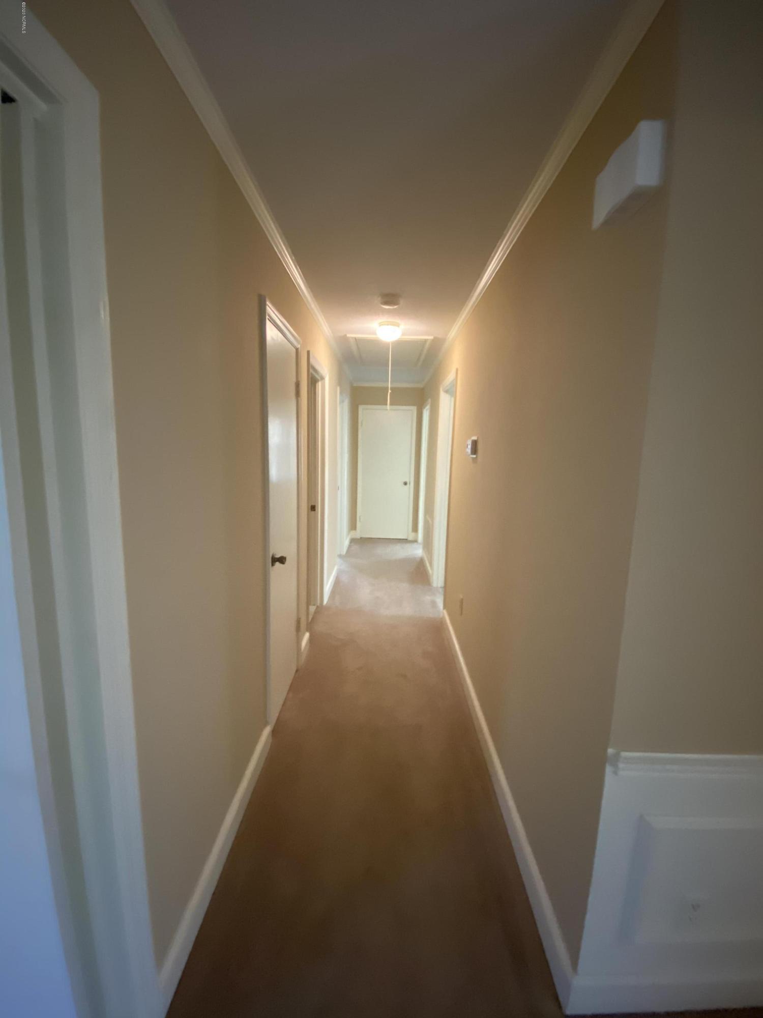 2308 Hardee Road Kinston, NC 28504 - Photo 10 of 23 The hallway leads to 3 bedrooms, 2 hall closets and a guest bathroom.