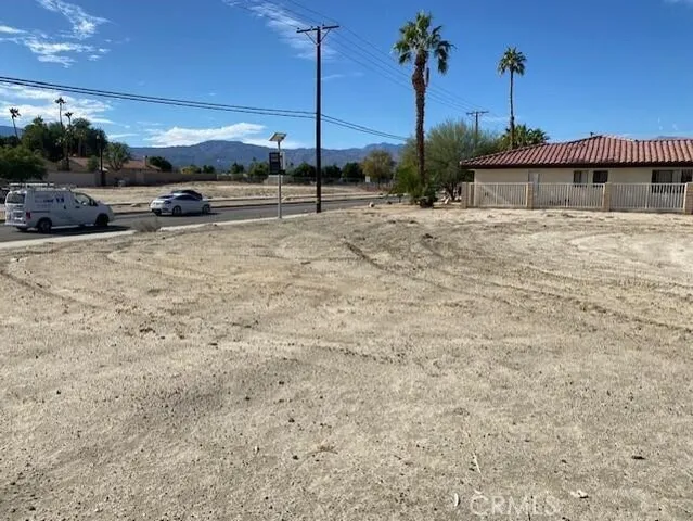 a view of a lake with a house in the background