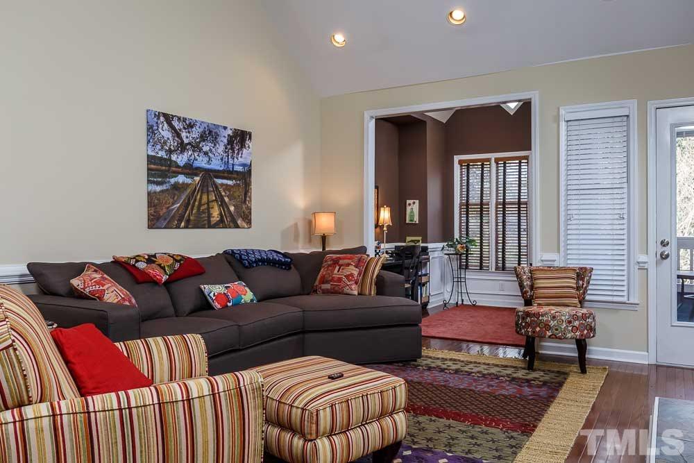 241 New Bern Place, Unit 301 Raleigh, NC 27601 - Photo 2 of 25 a living room with furniture and a rug