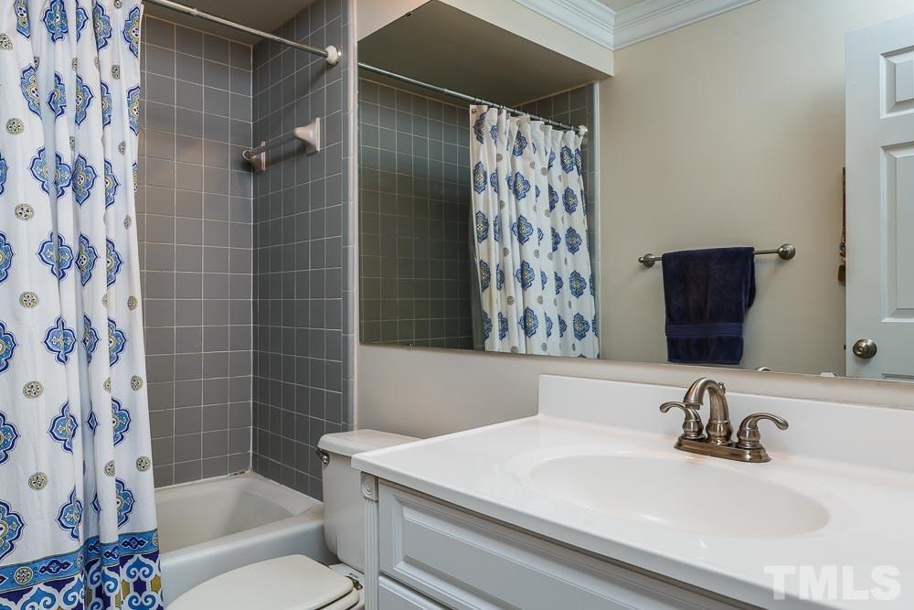 241 New Bern Place, Unit 301 Raleigh, NC 27601 - Photo 13 of 25 a bathroom with a sink toilet and shower