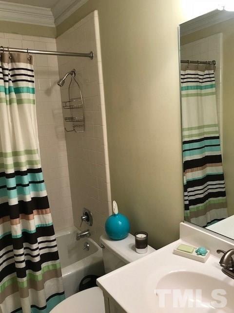 241 New Bern Place, Unit 301 Raleigh, NC 27601 - Photo 15 of 25 a bathroom with a sink and a mirror