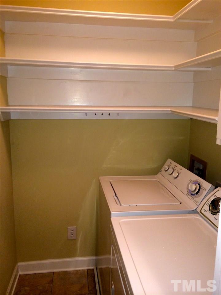 241 New Bern Place, Unit 301 Raleigh, NC 27601 - Photo 16 of 25 a utility room with dryer and washer