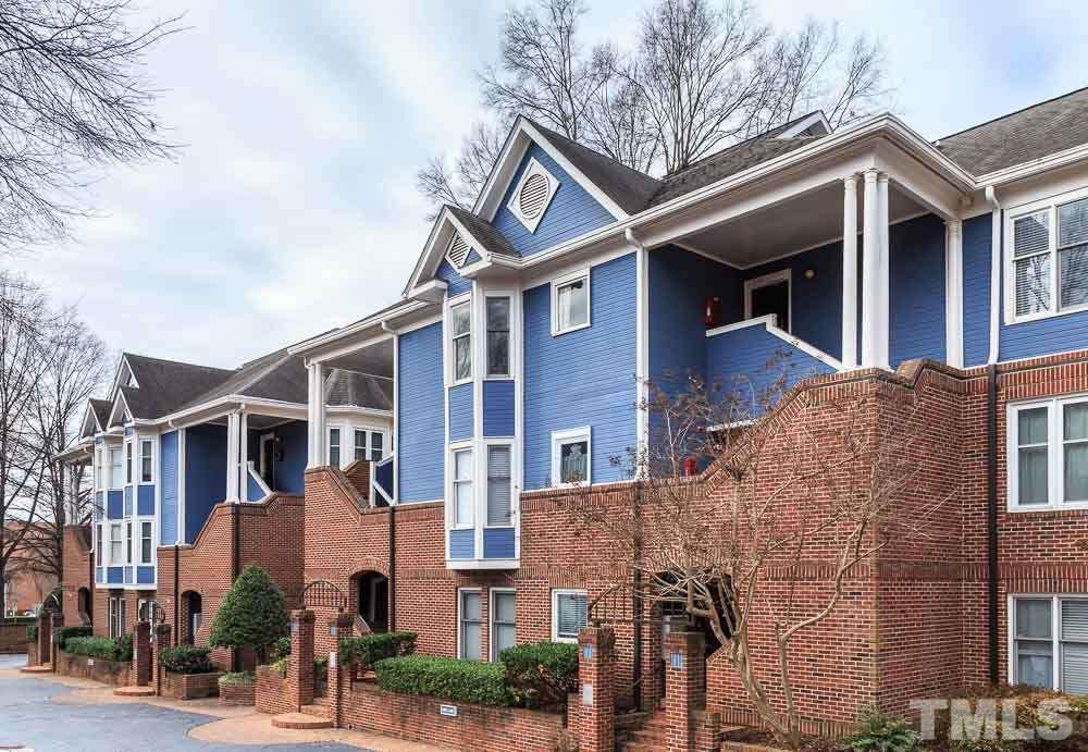 241 New Bern Place, Unit 301 Raleigh, NC 27601 - Photo 18 of 25 a front view of a house with a yard