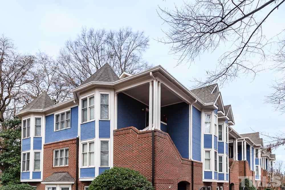 241 New Bern Place, Unit 301 Raleigh, NC 27601 - Photo 25 of 25 a view of a house with a large tree