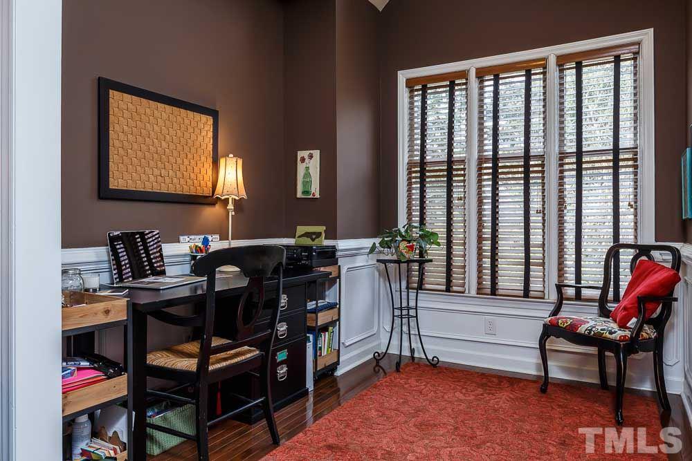 241 New Bern Place, Unit 301 Raleigh, NC 27601 - Photo 7 of 25 a view of a workspace with furniture and a window