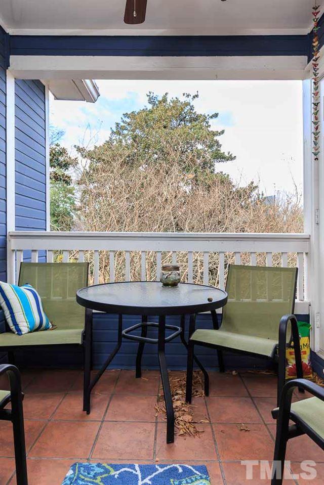 241 New Bern Place, Unit 301 Raleigh, NC 27601 - Photo 8 of 25 a living room with a couch and a table