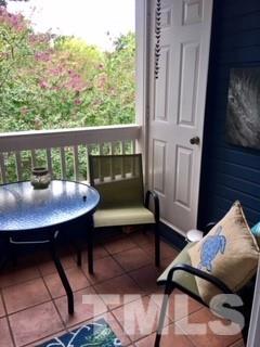 241 New Bern Place, Unit 301 Raleigh, NC 27601 - Photo 9 of 25 a view of a balcony with table and chairs