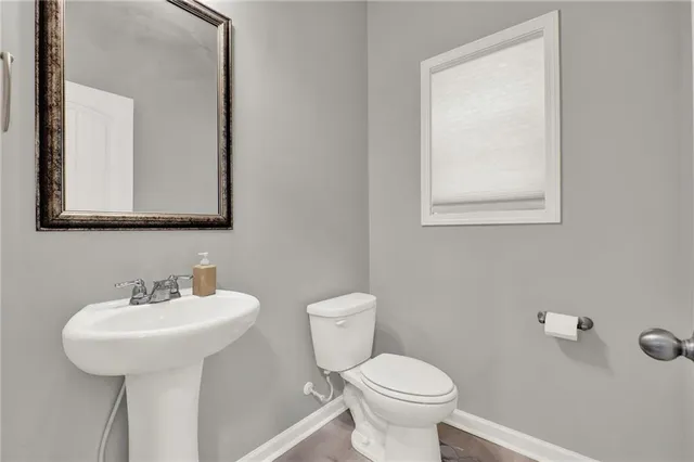 an empty room with windows and cabinet