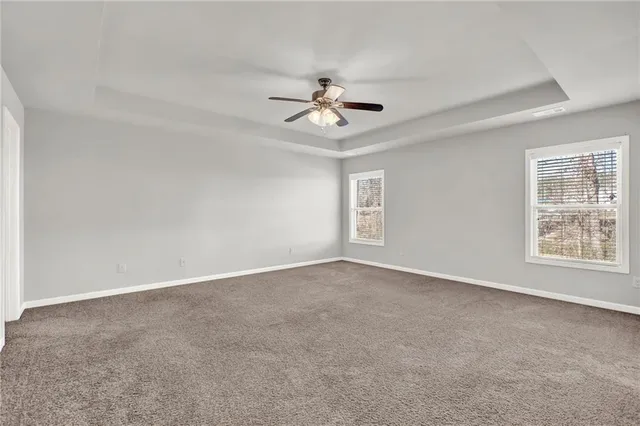 a bathroom with double vanity sink a vanity and a large mirror
