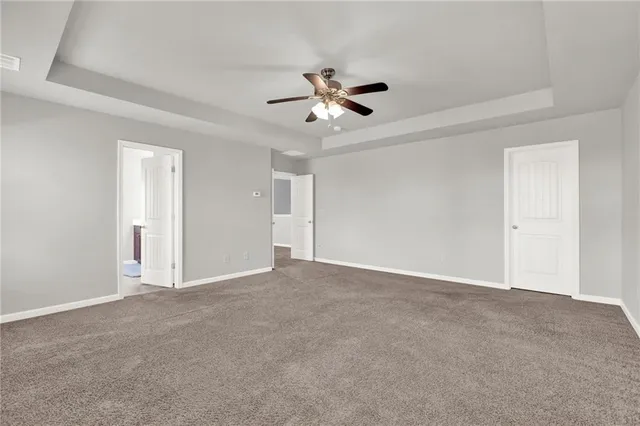 a white bath tub sitting next to a window