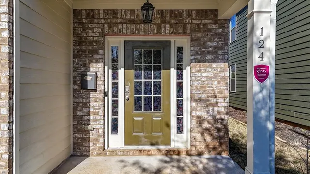 a front view of a house with a plants