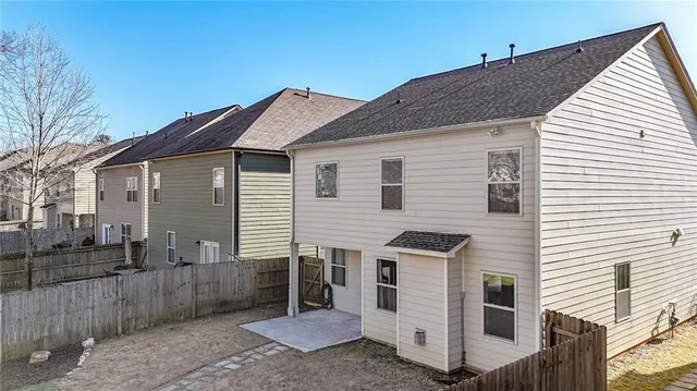 a backyard of a house with lots of green space and plants